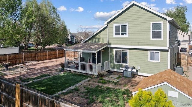 3904 Breaking Dawn St, Colorado Springs, CO 80925 - rear view of property featuring a fenced backyard and central AC