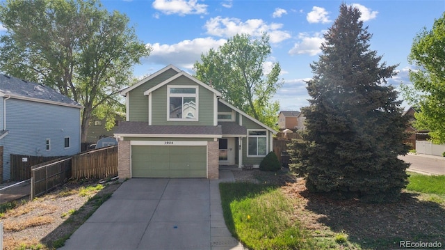 3904 Breaking Dawn St, Colorado Springs, CO 80925 - view of front of house featuring concrete driveway, brick siding, and an attached garage