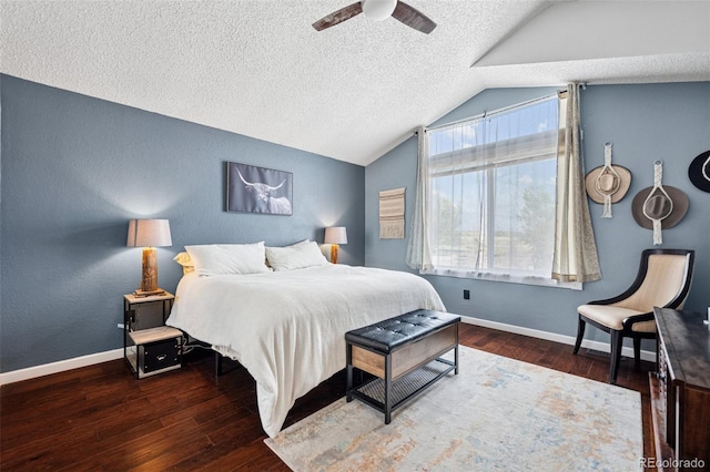 3904 Breaking Dawn St, Colorado Springs, CO 80925 - bedroom with a textured ceiling, lofted ceiling, wood finished floors, baseboards, and a textured wall
