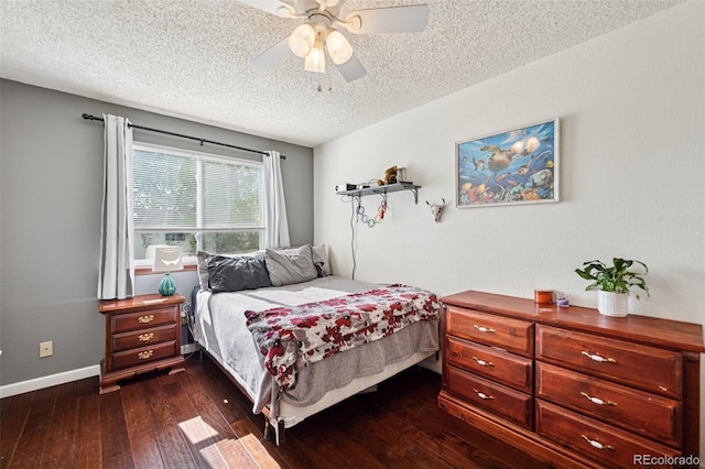 3904 Breaking Dawn St, Colorado Springs, CO 80925 - bedroom featuring dark wood finished floors, a textured ceiling, baseboards, and ceiling fan