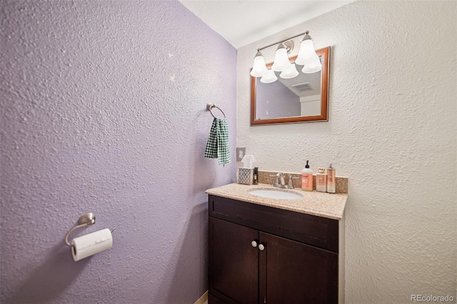 3904 Breaking Dawn St, Colorado Springs, CO 80925 - bathroom featuring vanity and a textured wall