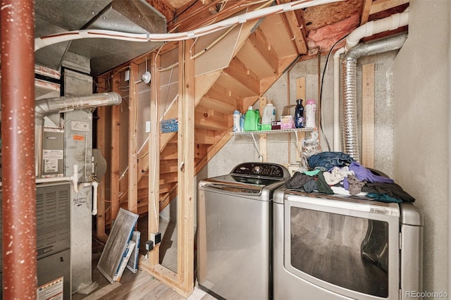 3904 Breaking Dawn St, Colorado Springs, CO 80925 - washroom with washer and clothes dryer and wood finished floors
