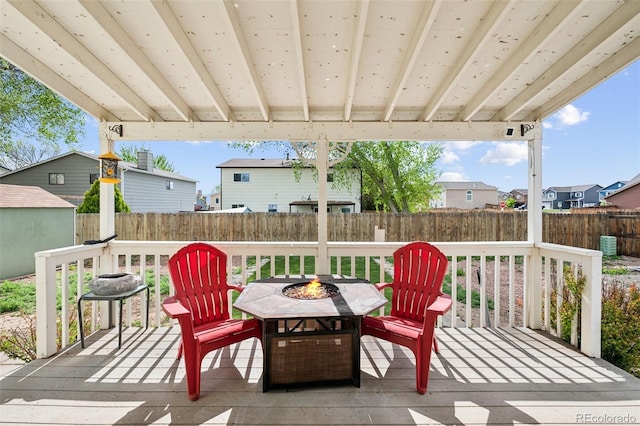 3904 Breaking Dawn St, Colorado Springs, CO 80925 - wooden deck with a fire pit, a fenced backyard, and a residential view