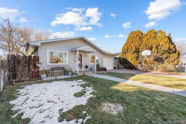 view of front of house with covered porch, a front yard, and a garage