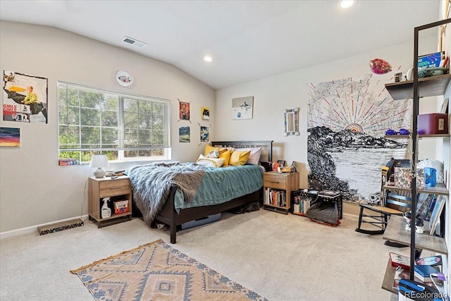 carpeted bedroom featuring lofted ceiling