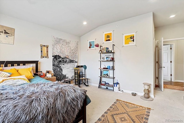 bedroom with carpet and vaulted ceiling