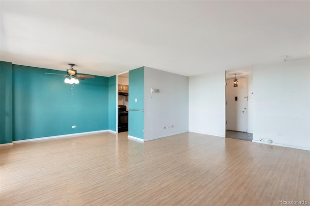 unfurnished living room with ceiling fan and light wood-type flooring