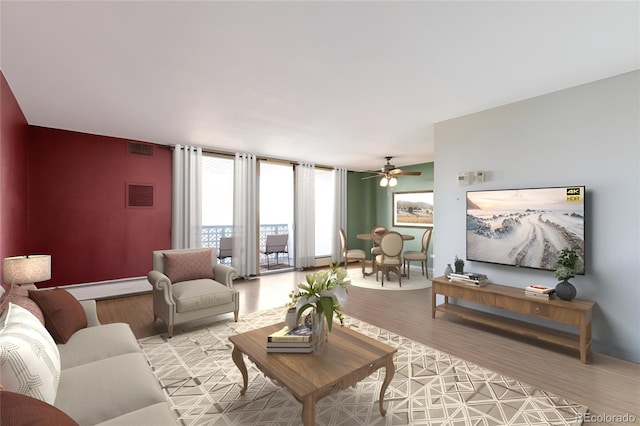 living room featuring baseboards, light wood-style floors, and visible vents