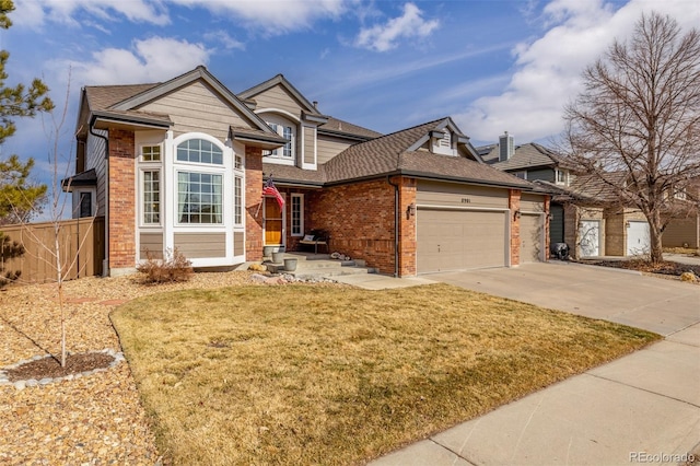 view of front of home with a garage and a front lawn