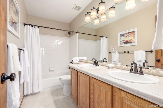 full bathroom featuring tile patterned flooring, vanity, shower / tub combo with curtain, and toilet