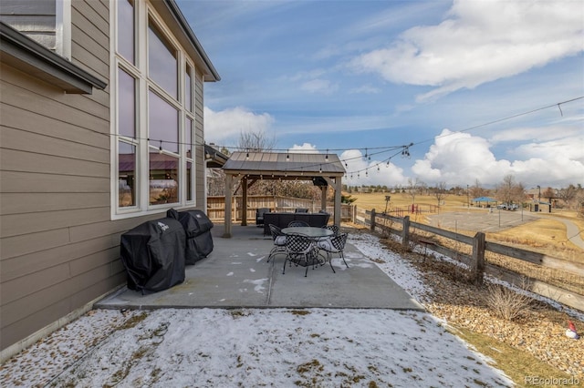 view of patio / terrace with a grill and a gazebo