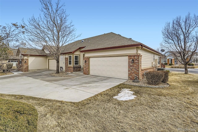 ranch-style home with a garage, concrete driveway, and brick siding