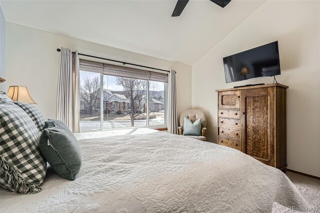 carpeted bedroom featuring access to exterior, vaulted ceiling, baseboards, and ceiling fan