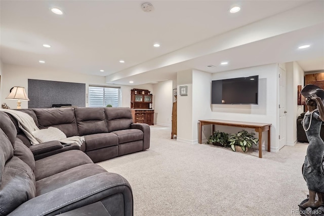 living area with baseboards, recessed lighting, and light colored carpet