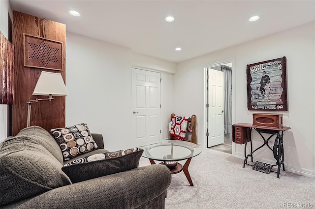 living room featuring recessed lighting, light carpet, and baseboards