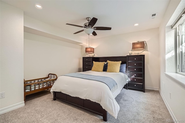 carpeted bedroom with ceiling fan, recessed lighting, visible vents, and baseboards