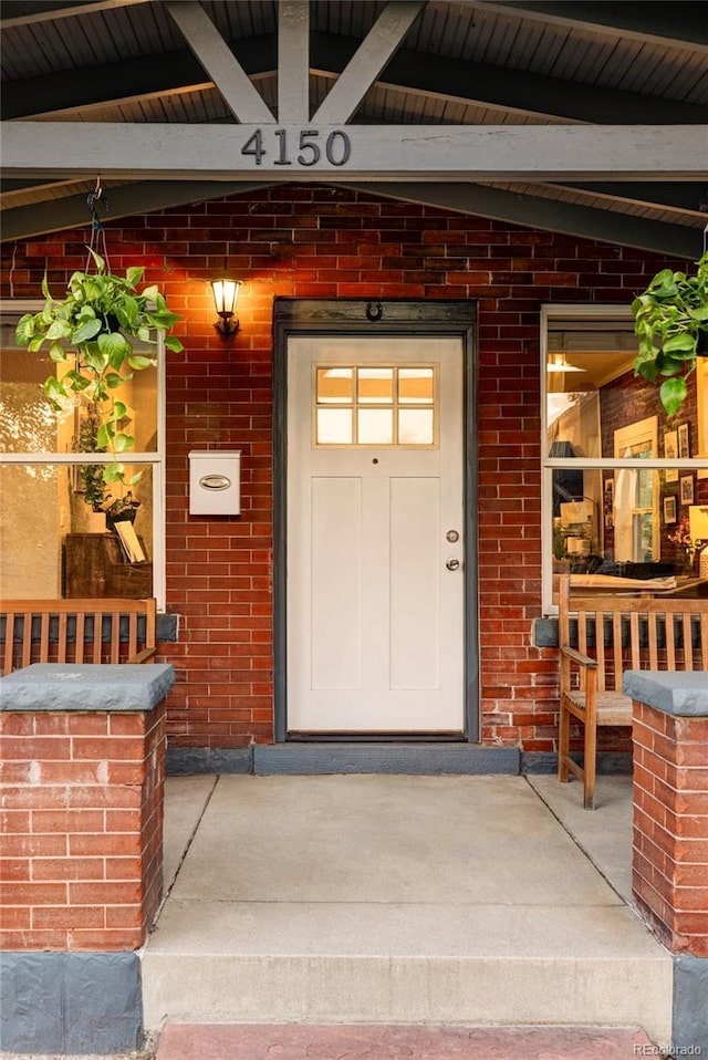 entrance to property with brick siding