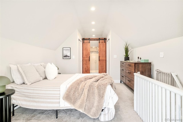 bedroom featuring recessed lighting, a barn door, vaulted ceiling, and light colored carpet