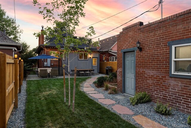 view of yard featuring a patio area and fence