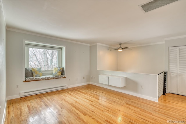 empty room with ornamental molding, visible vents, light wood-style flooring, and baseboard heating