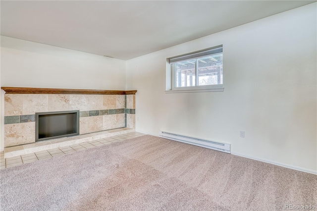 unfurnished living room featuring light carpet, baseboard heating, and a tile fireplace