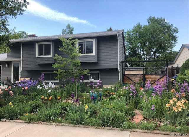 view of front of home featuring fence