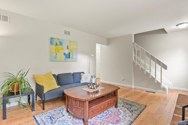 10310 E Jewell Ave Unit 55, Aurora, CO 80247 - living area with stairway, wood finished floors, and baseboards