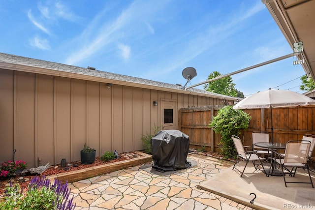 10310 E Jewell Ave Unit 55, Aurora, CO 80247 - view of patio featuring grilling area and outdoor dining space