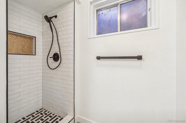 full bath with tiled shower