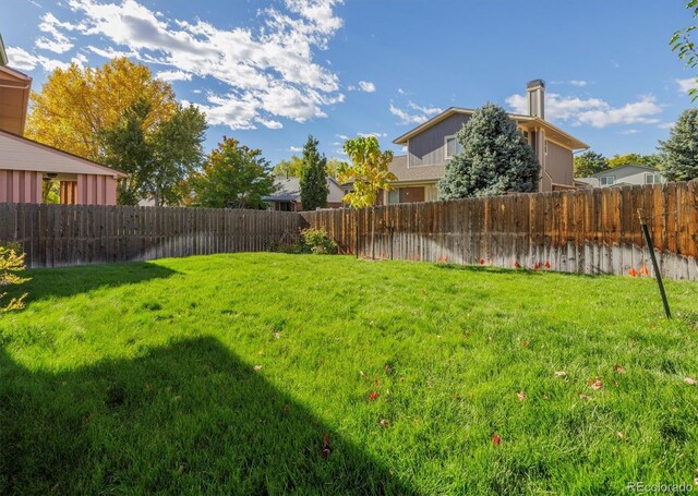 view of yard featuring a fenced backyard