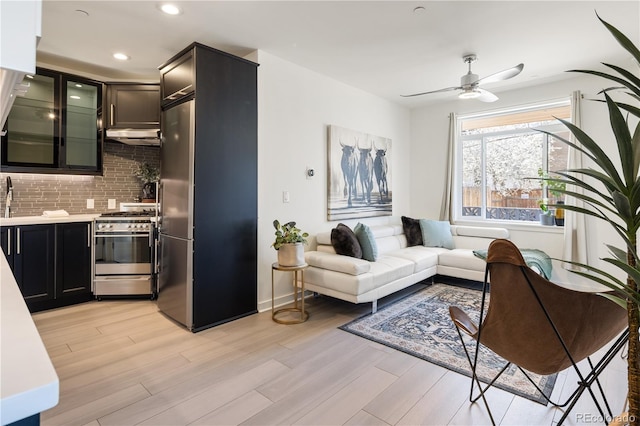 1922 E 18th Ave, Denver, CO 80206 - living area with light wood-type flooring, a ceiling fan, and recessed lighting