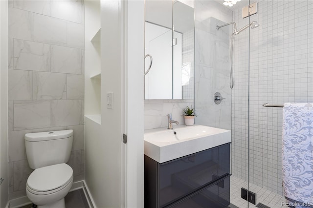 1922 E 18th Ave, Denver, CO 80206 - bathroom with tile walls, vanity, toilet, a shower stall, and decorative backsplash