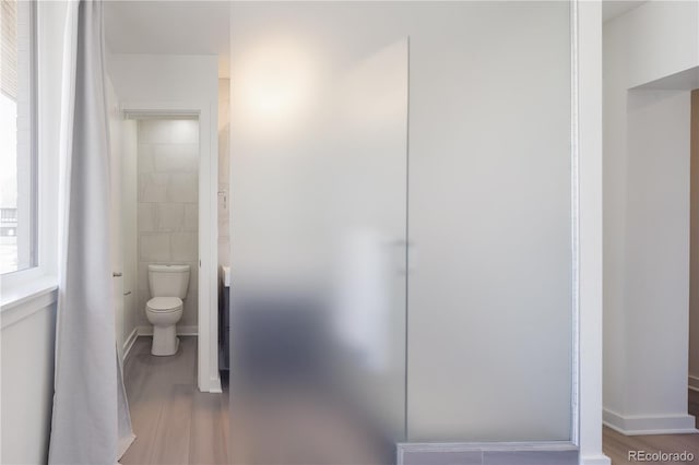 1922 E 18th Ave, Denver, CO 80206 - bathroom with toilet and wood finished floors