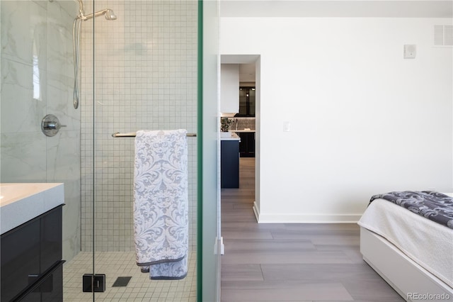 1922 E 18th Ave, Denver, CO 80206 - full bathroom with a shower stall, vanity, and baseboards