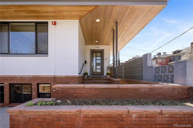 1922 E 18th Ave, Denver, CO 80206 - doorway to property featuring brick siding