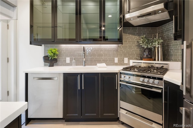 1922 E 18th Ave, Denver, CO 80206 - kitchen with appliances with stainless steel finishes, wall chimney range hood, a sink, backsplash, and light countertops