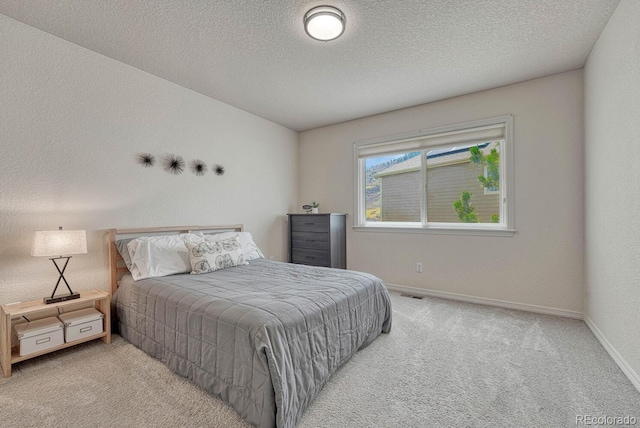 580 Eagle Nest Ct, Golden, CO 80401 - bedroom featuring carpet flooring, baseboards, and a textured ceiling
