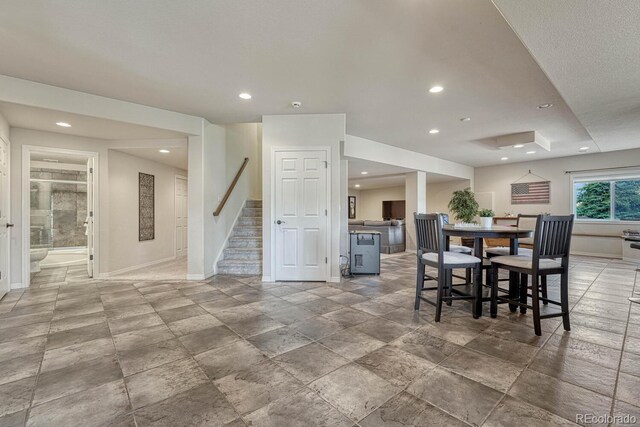 580 Eagle Nest Ct, Golden, CO 80401 - dining space with baseboards, recessed lighting, stairs, and stone finish flooring