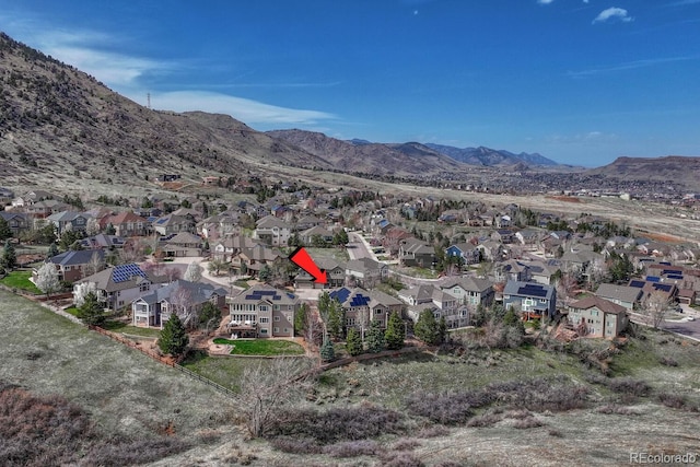 580 Eagle Nest Ct, Golden, CO 80401 - aerial view of property's location featuring nearby suburban area and a mountainous background