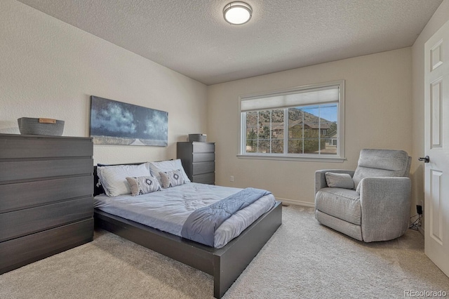 580 Eagle Nest Ct, Golden, CO 80401 - carpeted bedroom with a textured ceiling and baseboards