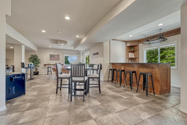 580 Eagle Nest Ct, Golden, CO 80401 - dining space featuring baseboards, recessed lighting, and a bar