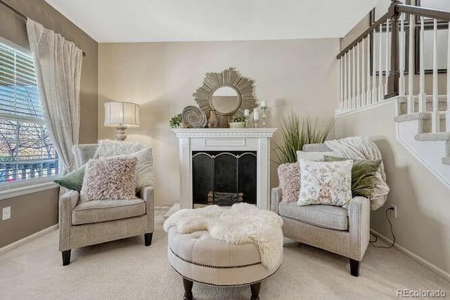 18655 E Garden Pl, Aurora, CO 80015 - living area with stairs, carpet floors, baseboards, and a fireplace