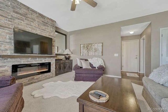 18655 E Garden Pl, Aurora, CO 80015 - living room with a large fireplace, a ceiling fan, baseboards, and wood finished floors