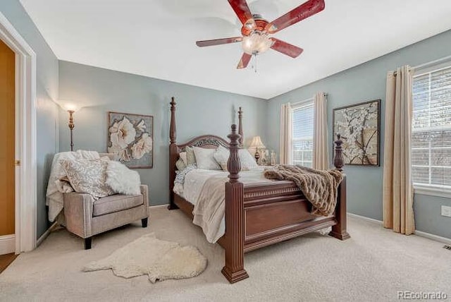 18655 E Garden Pl, Aurora, CO 80015 - bedroom with multiple windows, baseboards, and light carpet