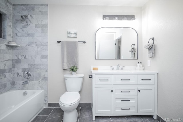 full bathroom with tile patterned flooring, vanity, tiled shower / bath combo, and toilet