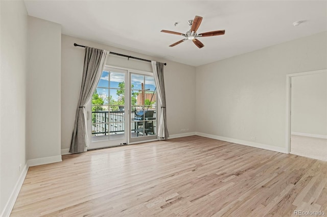 spare room with light hardwood / wood-style flooring and ceiling fan