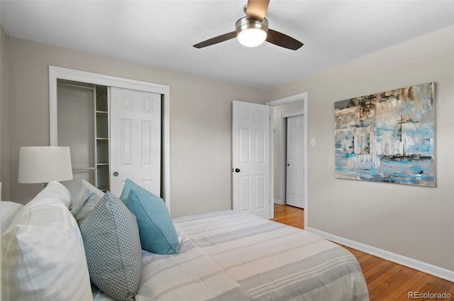 5315 Newland St, Arvada, CO 80002 - bedroom featuring a closet, wood finished floors, baseboards, and a ceiling fan
