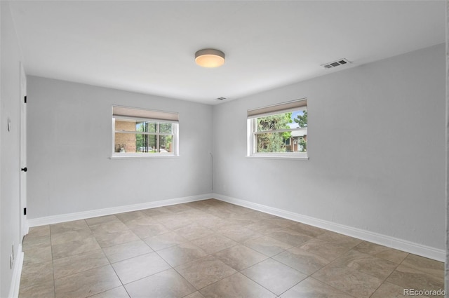 5315 Newland St, Arvada, CO 80002 - empty room with healthy amount of natural light and baseboards