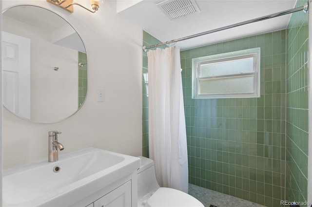 5315 Newland St, Arvada, CO 80002 - full bathroom with toilet, tiled shower, and vanity