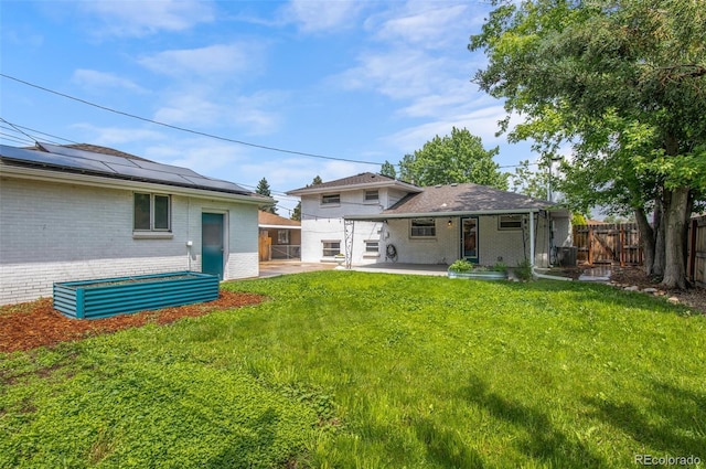 5315 Newland St, Arvada, CO 80002 - rear view of property with brick siding and a patio